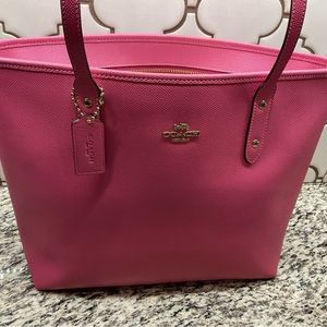 Pink leather Coach tote.